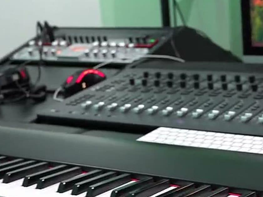 The Focusrite interface racked above the control desk, headphones at the ready